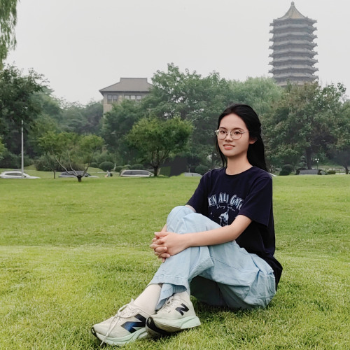 Chuanyue sitting on grass